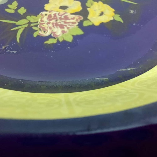 Porcelain ashtray used, blue shade with flowers and yellow details