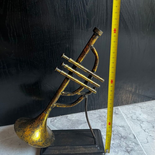 Vintage brass decorative musical instrument with black base, 30 cm
