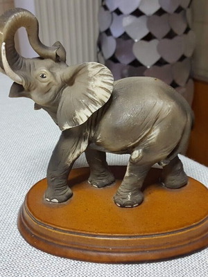 Decorative elephant figure used on wooden base