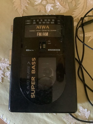 AIWA FM/AM radio cassette player used with headphones