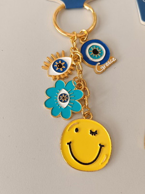Aegeanart keychain new, gold with smiley face and evil eye