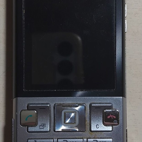 Sony Ericsson T700 phone used with charger and Memory Stick Micro