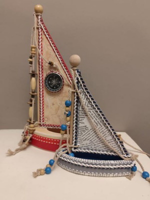 Two handmade wooden and cardboard boats
