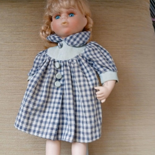 Porcelain doll used with stand, 33 cm tall