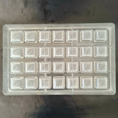 Polycarbonate mold for square chocolates used with feather design