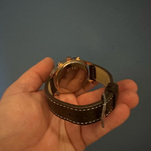 Wristwatch new with leather strap and white stitching