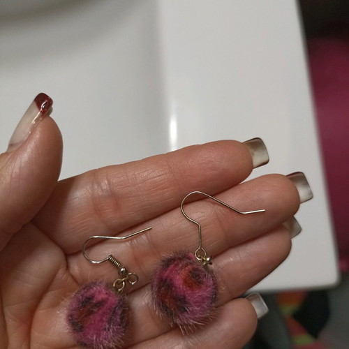 Pon pon animal print fuchsia earrings used
