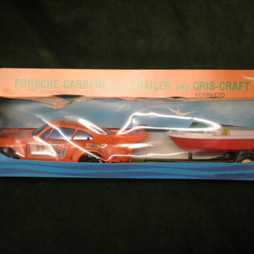 Winding Porsche Carrera car with Cris-Craft and trailer new