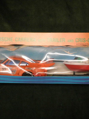 Winding Porsche Carrera car with Cris-Craft and trailer new