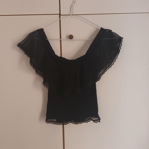 Black blouse with transparent polka dot design, off-shoulder