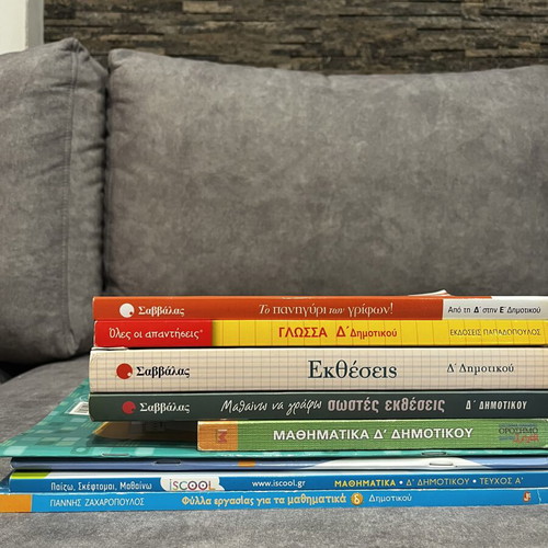Set of 9 used 4th Grade Educational Books with Math, Essays, and Puzzles