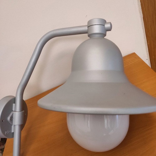 Wall-mounted cast outdoor sconce