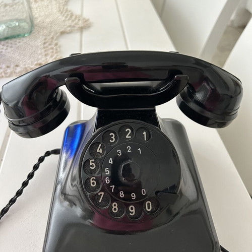 Bakelite telephone like new, black wired
