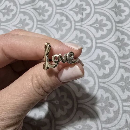 Love ring in gold tone like new