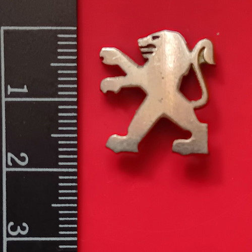 Small metal lion badge used