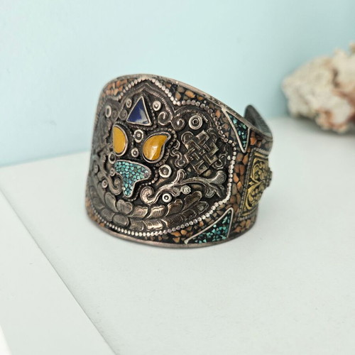 Handmade carved bracelet used with turquoise and silver