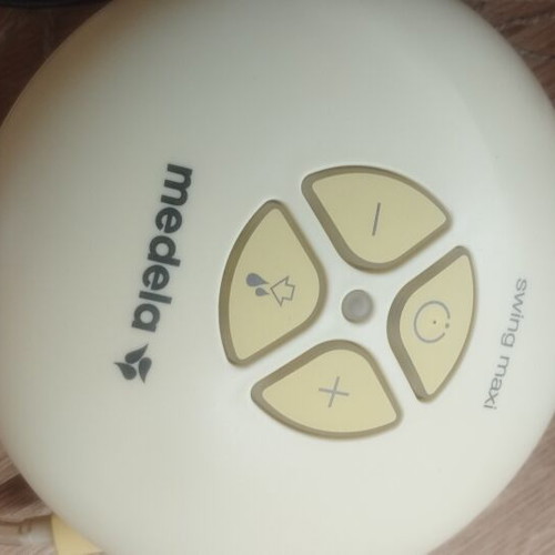Medela Swing Maxi double breast pump with bra and accessories