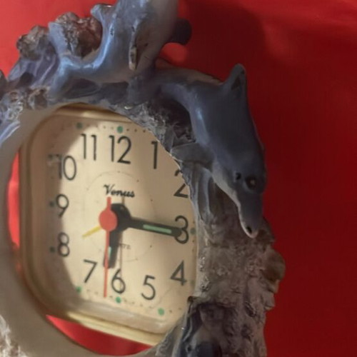 Clock used with dolphins around