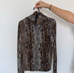Polo blouse leopard print size S like new