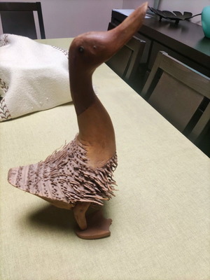 Wooden duck made from tree root used handmade