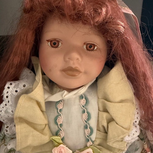 Porcelain doll like new with ginger hair