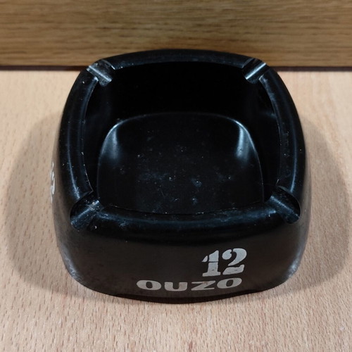 Ouzo 12 square black plastic ashtray used