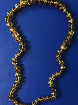 Necklace with amber-colored beads like new
