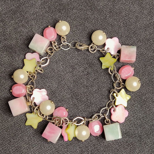 Charm bracelet in pastel pink, mint and white shades like new