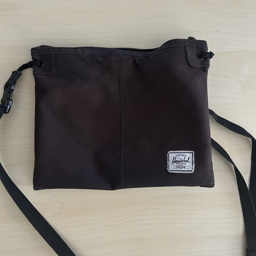 Herschel crossbody bag used with some wear
