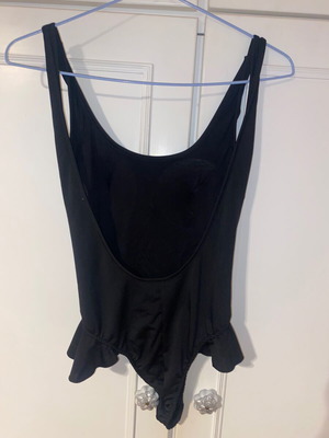 One-piece swimsuit like new, black with frill details and gathered back