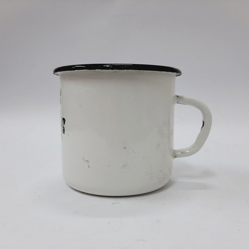 Vintage enamel metal mug with floral motif
