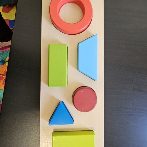 Hape shape puzzle used with marks from small hands