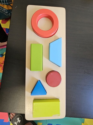 Hape shape puzzle used with marks from small hands