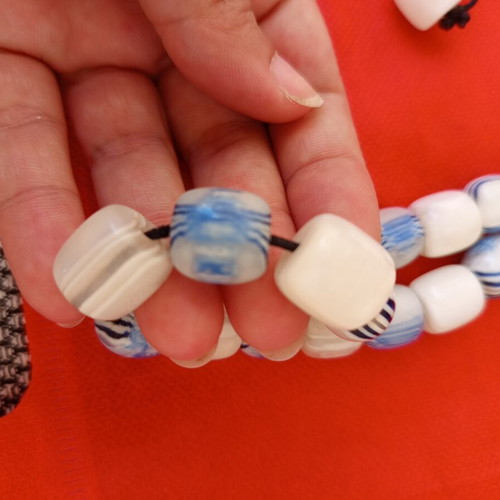 Worry beads with white and blue shiny beads