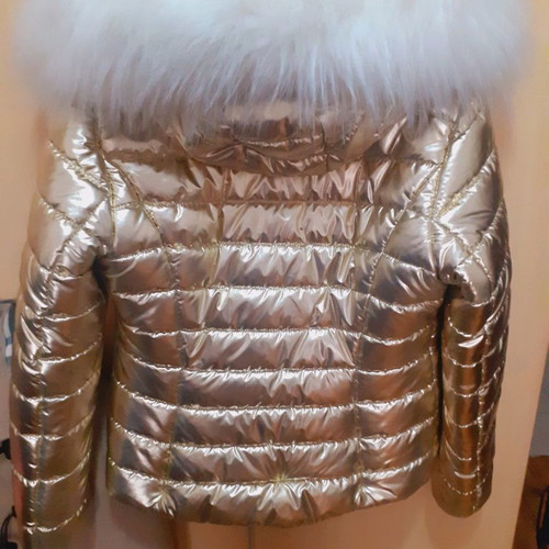 Short gold jacket with white fur and hood