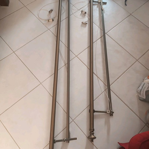 Bronze curtain rods like new with manual mechanism and rail