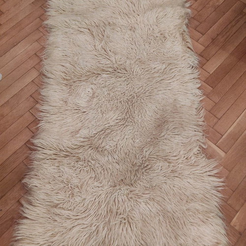 White flokati rug used, rectangular 70x130