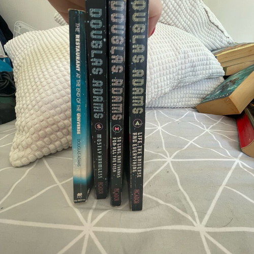 Adam Douglas books used, set of 4, English