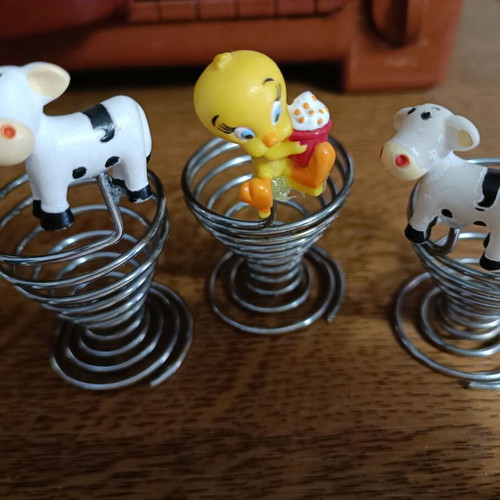 Set of 3 used egg holders with children characters, stainless steel