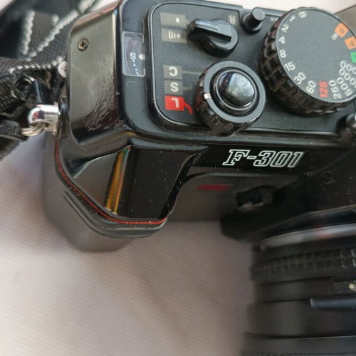 Nikon F301 camera used with 35-135 lens and flash