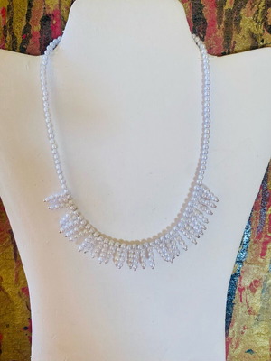 Necklace with white faux pearls and fringe design, new