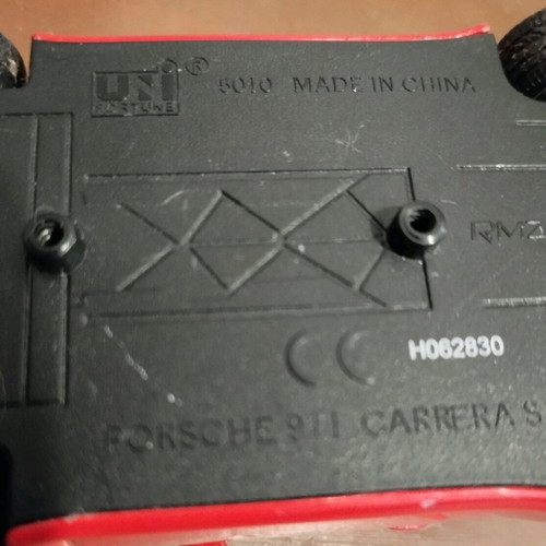 Collectible Porsche Carrera toy car with opening doors like new