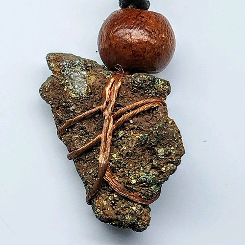 Pendant with pyrite new, gold copper wire and leather