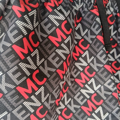 McKenzie Shorts Swimwear new, black with red print, size 12-13 years