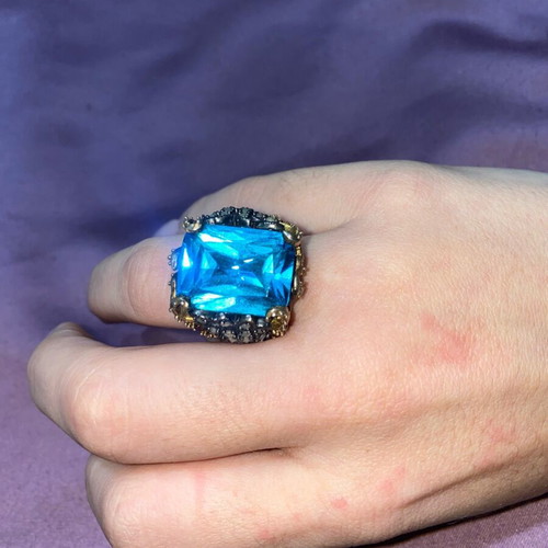 Silver ring plated with 9K gold, like new, blue topaz center