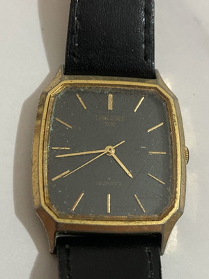 Orient VX Quartz Japan vintage wristwatch used, black dial, gold-tone case