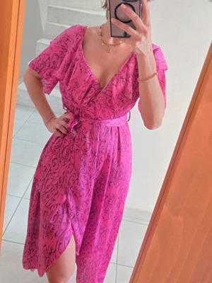 Wrap dress in bright fuchsia with ruffle sleeves
