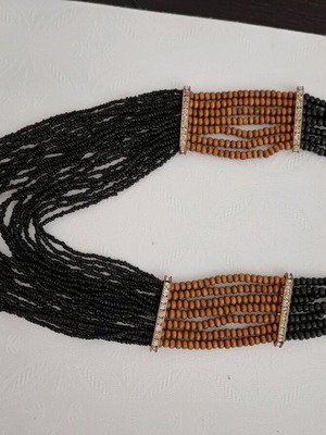 Beaded necklace like new, brown and black with gold details