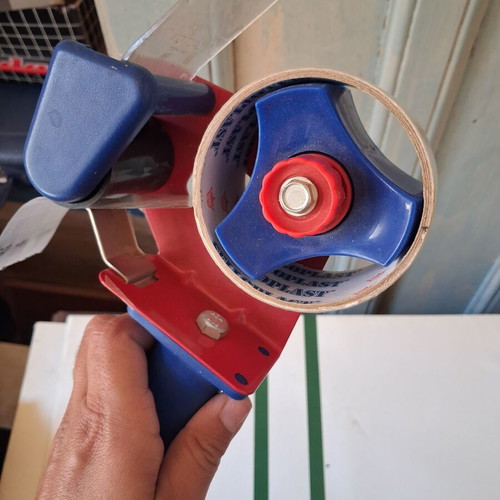 Packing tape gun used with roll included