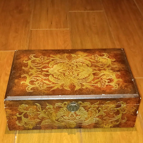 Wooden antique box used with embossed bronze decorations